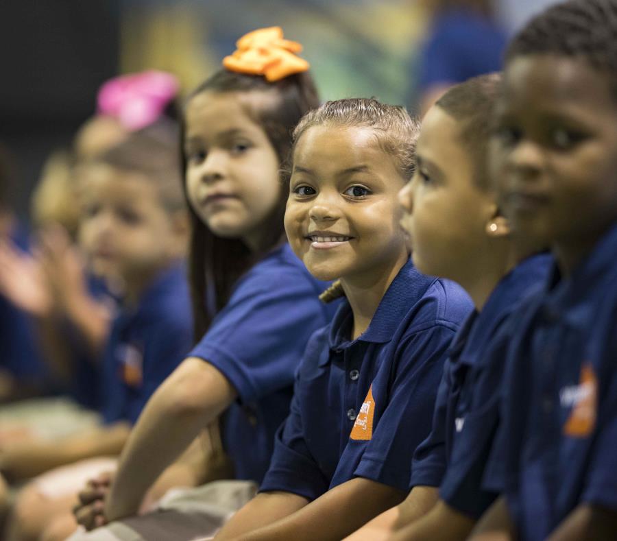 Students looking at the camera and smiling